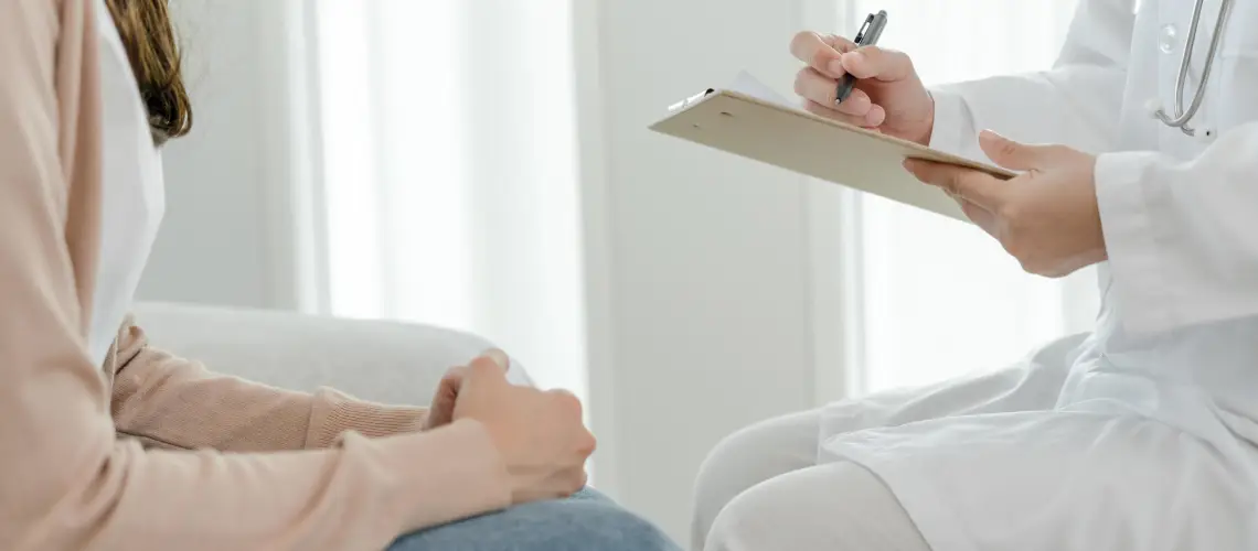 Australian doctor discussing medical options with a patient in a clinic